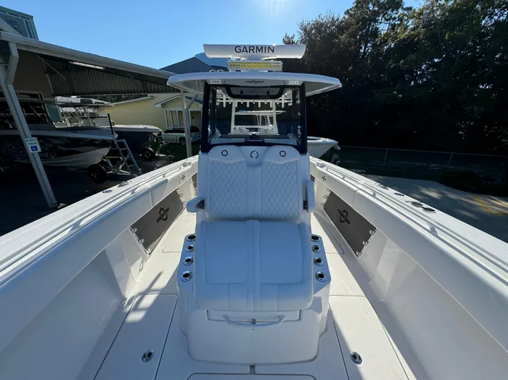  Yacht Photos Pics 2025 Fountain 38TE boat with Garmin equipment, docked under clear skies.