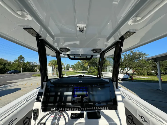  Yacht Photos Pics 2025 Fountain 38TE boat cockpit with advanced navigation system and sleek design.