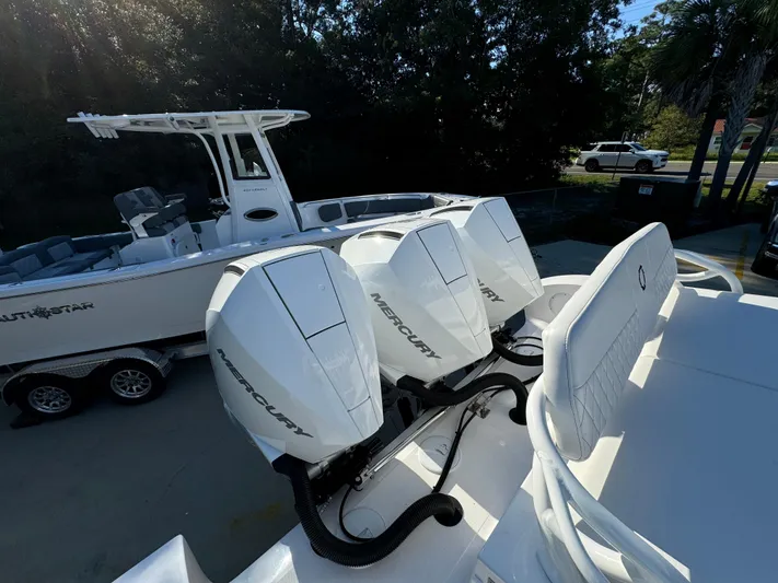  Yacht Photos Pics 2025 Fountain 38TE boat with triple Mercury outboard engines, parked on a trailer.