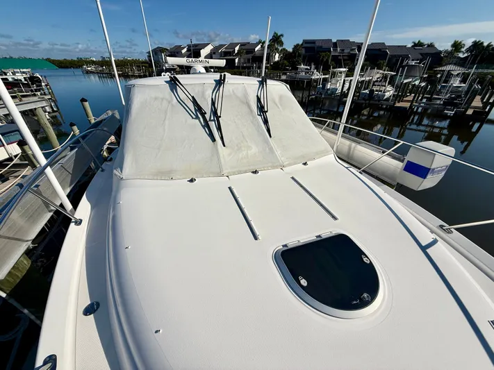  Yacht Photos Pics 2008 Tiara Yachts 3500 Sovran on calm waters in harbor.