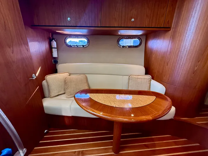  Yacht Photos Pics Interior of 2008 Tiara Yachts 3500 Sovran with wooden table and seating.