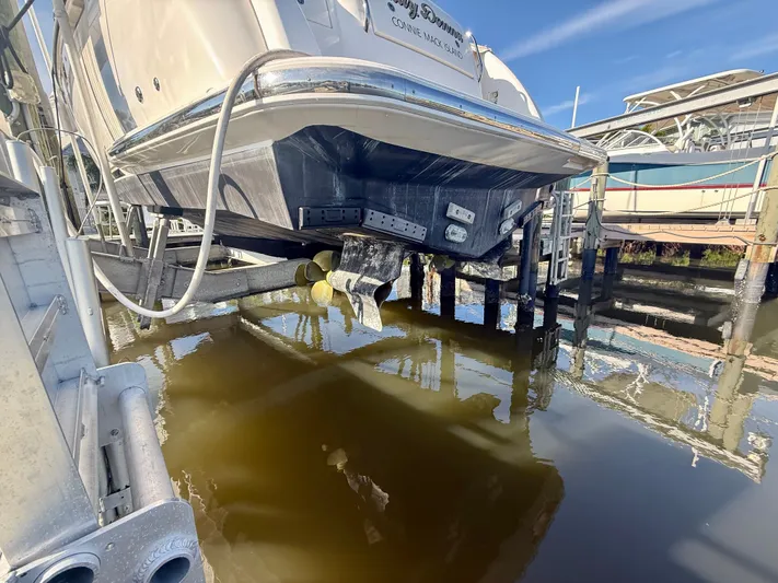  Yacht Photos Pics 2008 Tiara Yachts 3500 Sovran on a boat lift at the dock.
