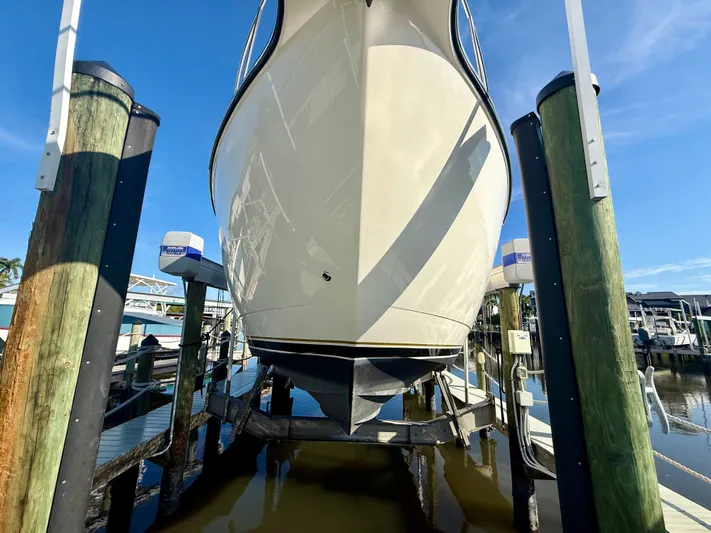  Yacht Photos Pics 2008 Tiara Yachts 3500 Sovran on boat lift at marina.