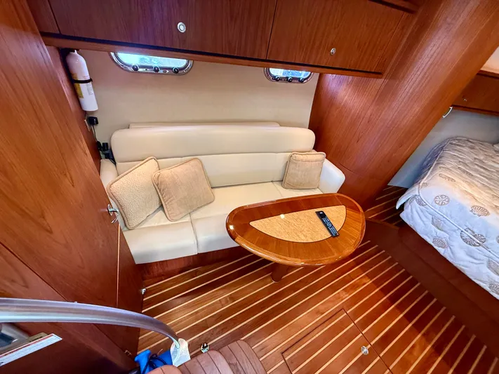  Yacht Photos Pics Interior of 2008 Tiara Yachts 3500 Sovran with sofa and wooden table.