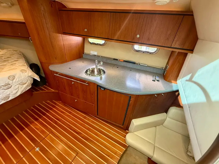  Yacht Photos Pics Interior of 2008 Tiara Yachts 3500 Sovran with kitchenette and seating area.