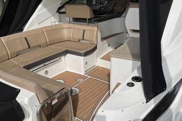  Yacht Photos Pics Luxurious 2017 Sea Ray Sundancer 350 interior with beige seating and wood flooring.