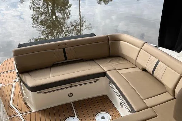  Yacht Photos Pics 2017 Sea Ray Sundancer 350, featuring elegant tan seating and teak flooring by the water.