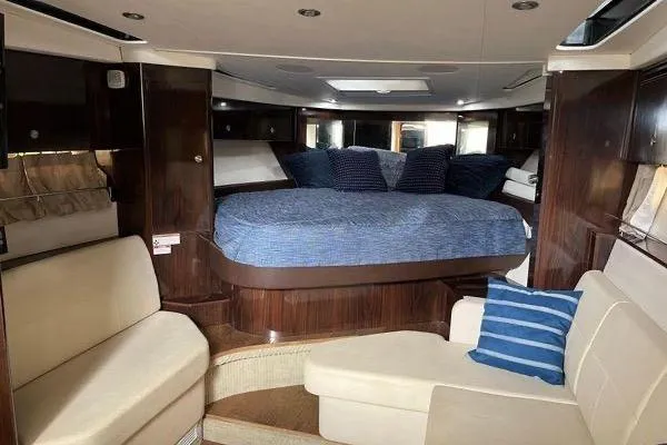  Yacht Photos Pics Luxurious interior of 2017 Sea Ray Sundancer 350 yacht with cozy seating and bed.