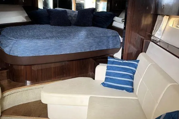  Yacht Photos Pics Interior of 2017 Sea Ray Sundancer 350 with cozy bed and seating area.