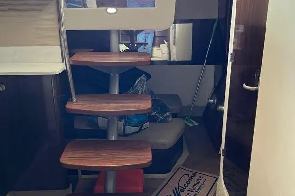  Yacht Photos Pics Interior of 2017 Sea Ray Sundancer 350 with wooden steps and cozy seating area.