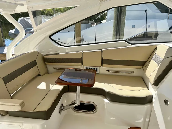  Yacht Photos Pics Luxurious seating area on a 2020 Pursuit DC 365 boat with elegant table.