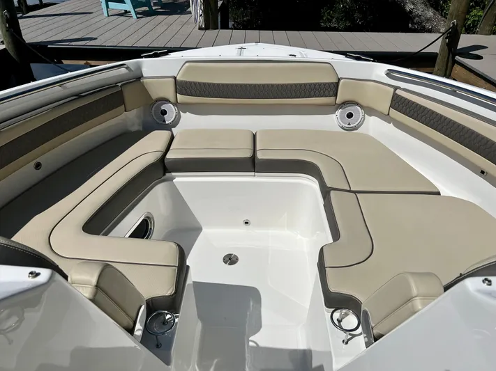  Yacht Photos Pics 2020 Pursuit DC 365 boat interior with beige seating and spacious layout.