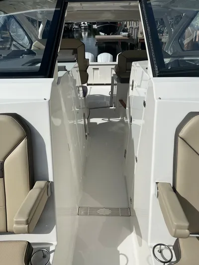  Yacht Photos Pics 2020 Pursuit DC 365 boat interior with beige seating and sleek design.