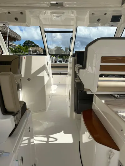  Yacht Photos Pics Interior of 2020 Pursuit DC 365 boat, featuring sleek seating and modern design.