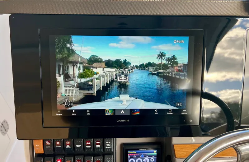  Yacht Photos Pics Dashboard view of a 2020 Pursuit DC 365 boat with Garmin navigation display.