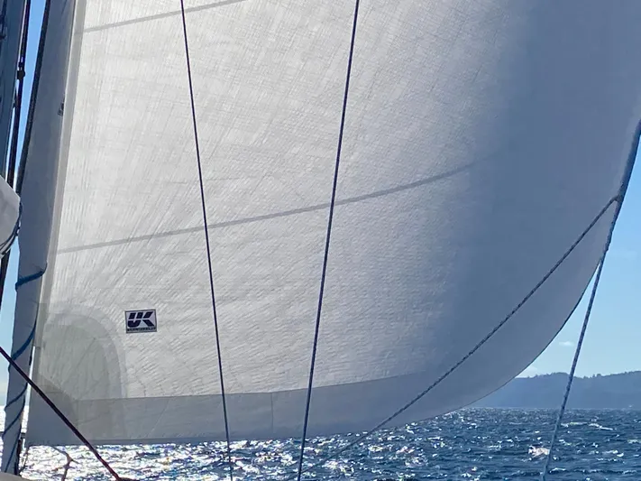 Imagine Yacht Photos Pics Sail of a 1990 J Boats J/44 yacht gliding on sparkling water.