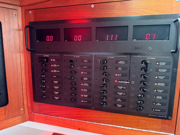 Imagine Yacht Photos Pics Electrical control panel on a 1990 J Boats J/44 sailboat, featuring digital displays and switches.