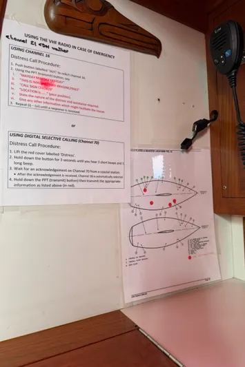 Imagine Yacht Photos Pics VHF radio instructions and diagrams on a 1990 J Boats J/44 sailboat interior.
