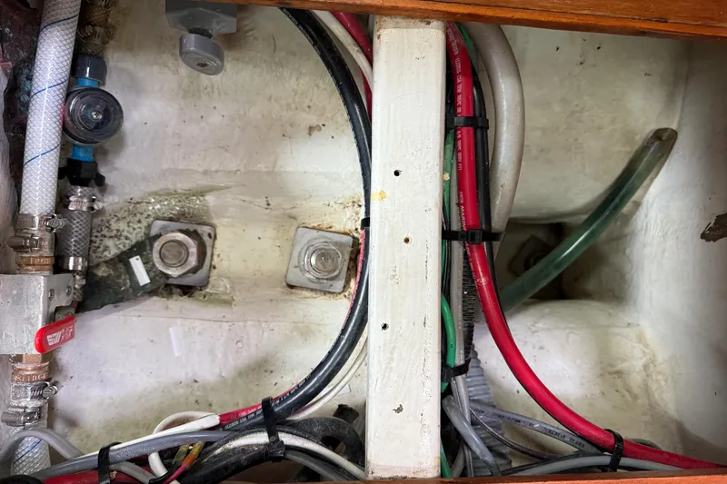 Imagine Yacht Photos Pics Interior view of 1990 J Boats J/44 showing wiring and plumbing components.