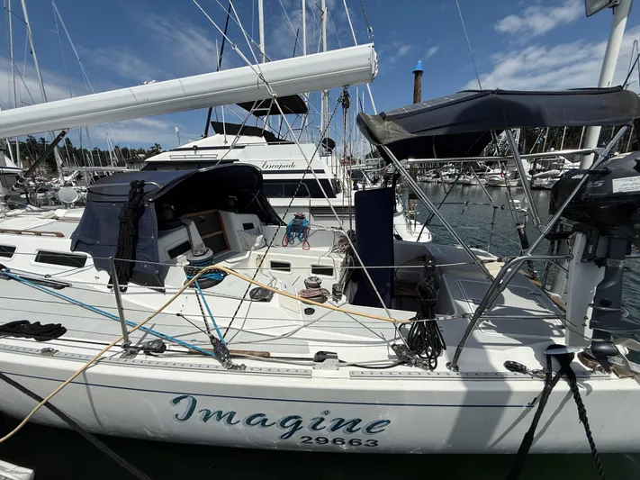 Imagine Yacht Photos Pics 1990 J Boats J/44 sailboat "Imagine" docked in marina under clear blue sky.