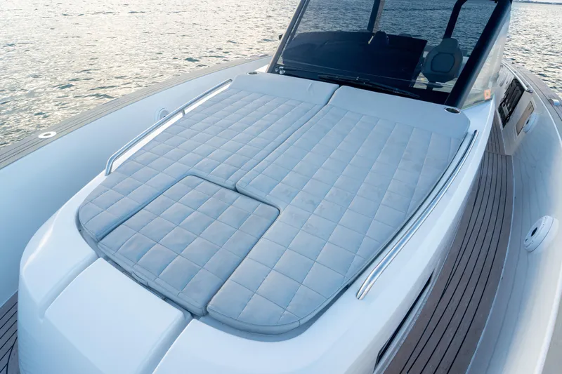 Katerina Yacht Photos Pics 2021 Pardo Yachts 43 with spacious sunbed on deck, overlooking serene waters.