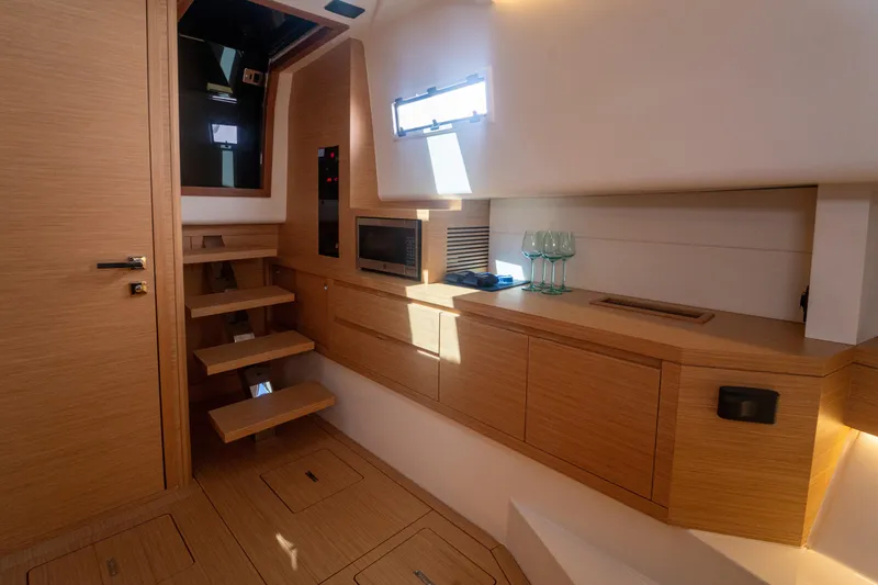 Katerina Yacht Photos Pics Luxurious interior of 2021 Pardo Yachts 43, featuring modern wood cabinetry and sleek design.