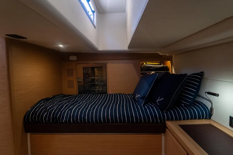 Katerina Yacht Photos Pics Interior cabin of 2021 Pardo Yachts 43 with striped bedding and modern design.