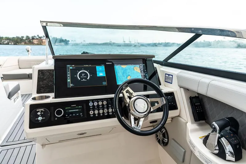  Yacht Photos Pics 2021 Sea Ray 350 SLX OB boat dashboard with navigation screens and steering wheel.