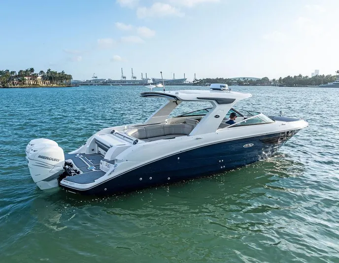  Yacht Photos Pics 2021 Sea Ray 350 SLX OB boat on calm water, featuring sleek design and powerful outboard engine.