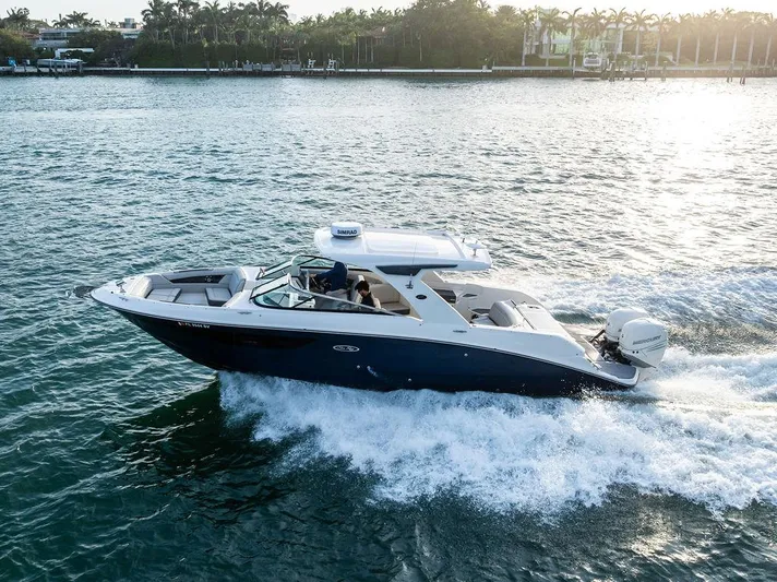  Yacht Photos Pics 2021 Sea Ray 350 SLX OB cruising on a sunny day, showcasing sleek design and powerful performance.