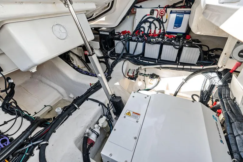  Yacht Photos Pics Engine compartment of 2021 Sea Ray 350 SLX OB, showcasing wiring and battery setup.