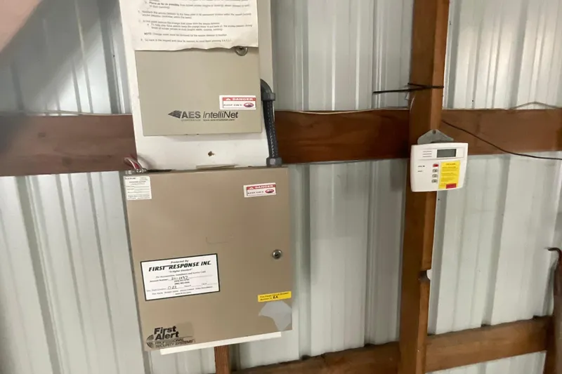  Yacht Photos Pics Security system panel in a 1995 custom boathouse with metal siding.