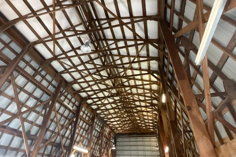  Yacht Photos Pics Wooden truss ceiling of a 1995 custom boathouse interior.