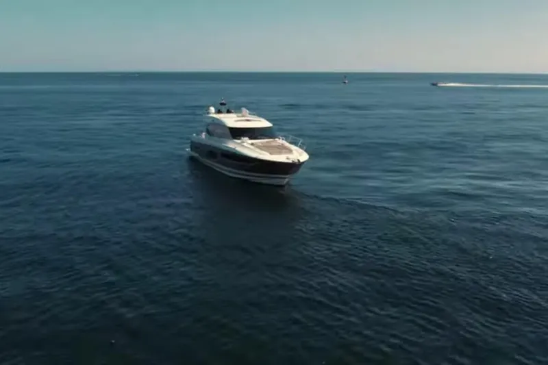  Yacht Photos Pics Prestige 550 S yacht cruising on open sea, 2013 model.