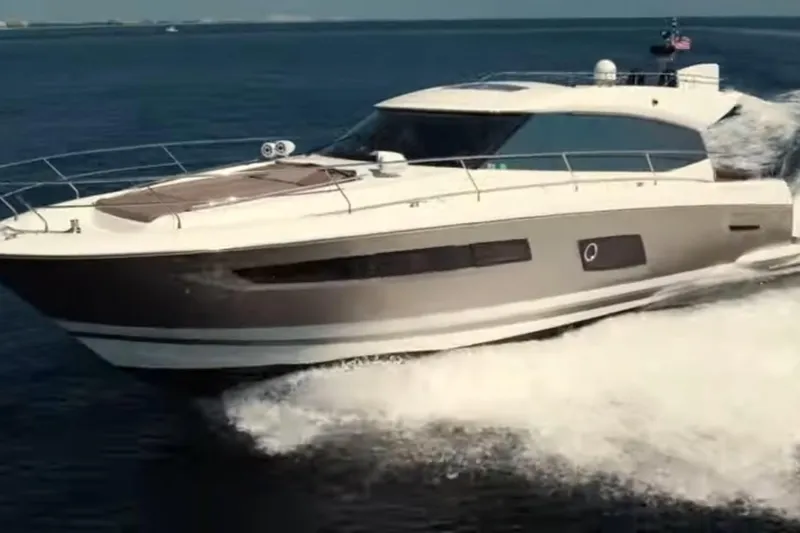  Yacht Photos Pics 2013 Prestige 550 S yacht cruising on open water, showcasing sleek design and luxury.