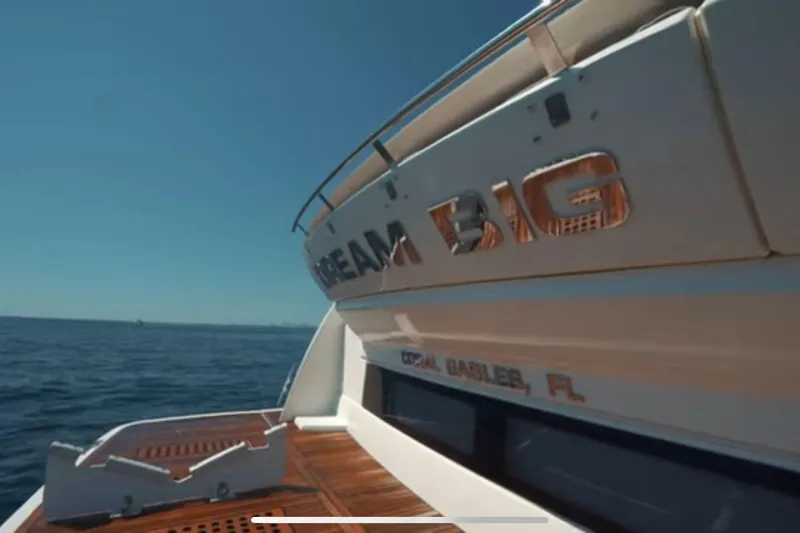  Yacht Photos Pics 2013 Prestige 550 S yacht with "Dream Big" lettering, Coral Gables, FL, on open sea.