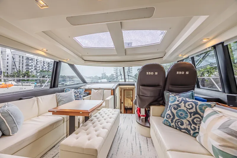  Yacht Photos Pics Luxurious interior of 2013 Prestige 550 S yacht with elegant seating and panoramic windows.