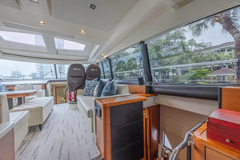  Yacht Photos Pics Luxurious interior of 2013 Prestige 550 S yacht with modern seating and panoramic windows.