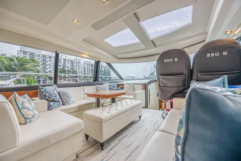  Yacht Photos Pics Luxurious interior of 2013 Prestige 550 S yacht with elegant seating and panoramic windows.