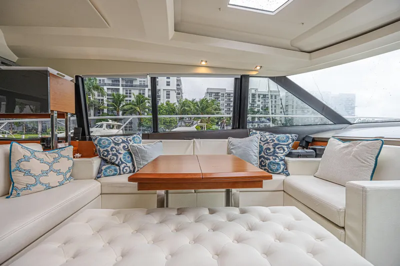  Yacht Photos Pics Luxurious interior of 2013 Prestige 550 S yacht with elegant seating and decorative pillows.