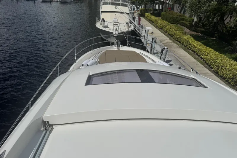  Yacht Photos Pics 2013 Prestige 550 S yacht docked, showcasing sleek design and spacious deck.
