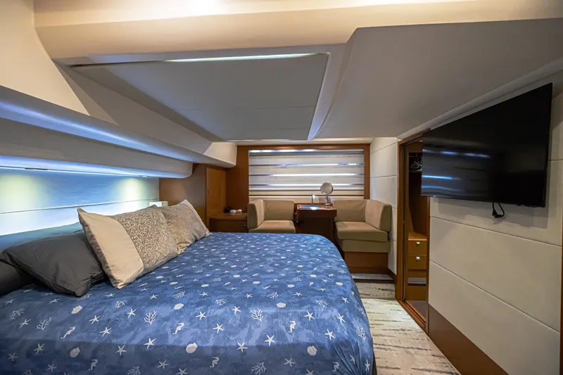  Yacht Photos Pics Luxurious bedroom interior of 2013 Prestige 550 S yacht with modern amenities.