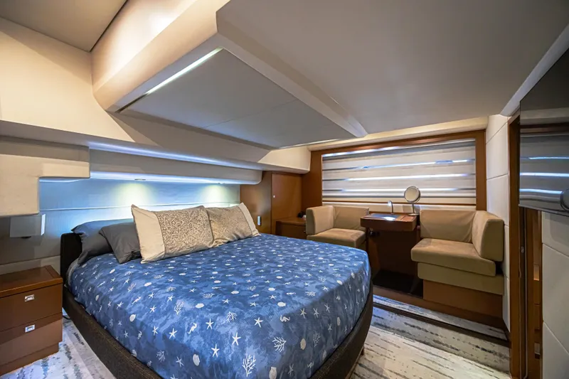  Yacht Photos Pics Luxurious bedroom interior of 2013 Prestige 550 S yacht with elegant furnishings.
