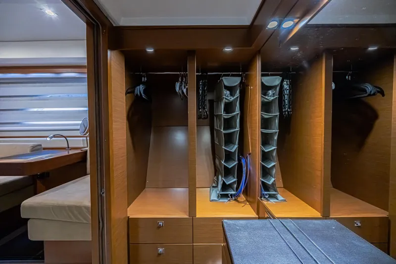  Yacht Photos Pics Luxurious wooden closet interior on a 2013 Prestige 550 S yacht.