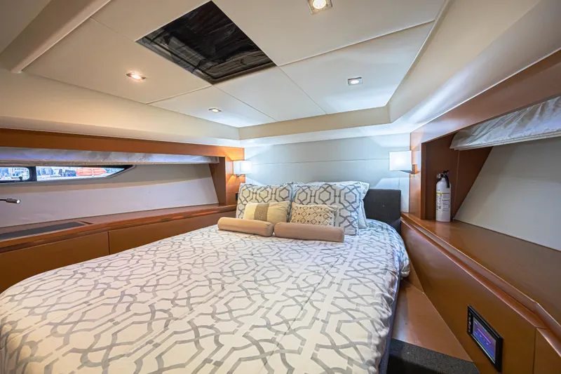  Yacht Photos Pics Luxurious bedroom interior of 2013 Prestige 550 S yacht with modern design and cozy bedding.