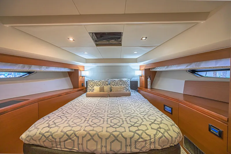  Yacht Photos Pics Luxurious bedroom interior of 2013 Prestige 550 S yacht with modern design and cozy bedding.