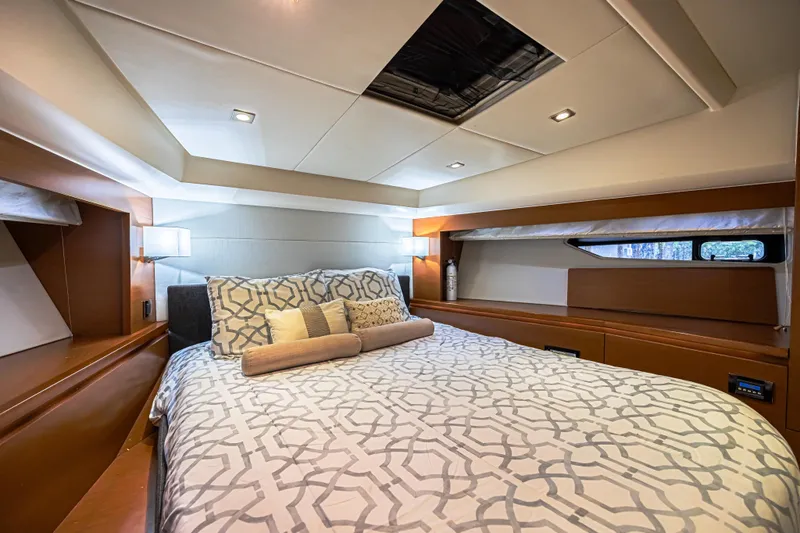  Yacht Photos Pics Luxurious bedroom interior of 2013 Prestige 550 S yacht with elegant bedding and modern lighting.