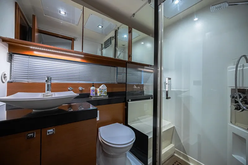 Yacht Photos Pics Luxurious bathroom in 2013 Prestige 550 S yacht with modern fixtures and glass shower.