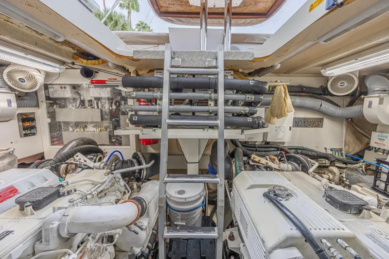 Yacht Photos Pics Engine room of 2013 Prestige 550 S yacht with visible machinery and equipment.