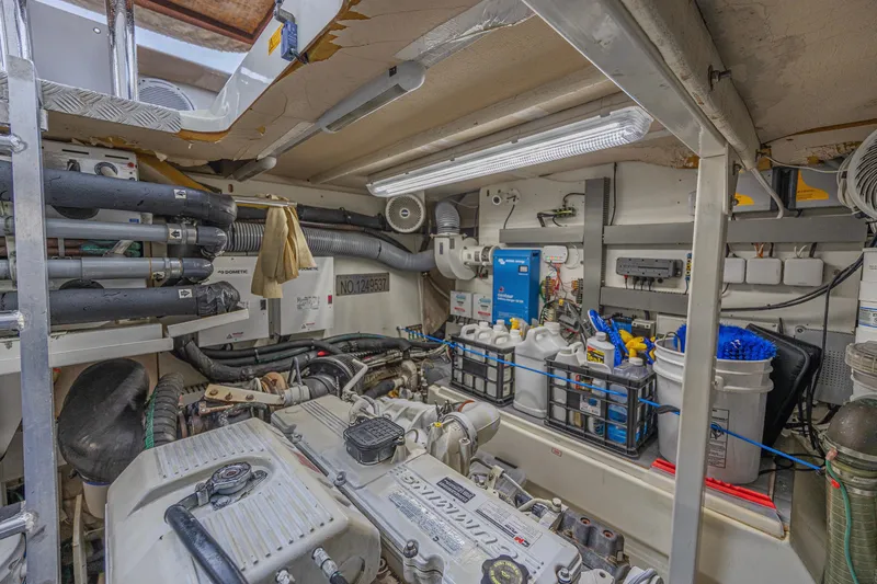  Yacht Photos Pics Engine room of a 2013 Prestige 550 S yacht, featuring organized equipment and storage.